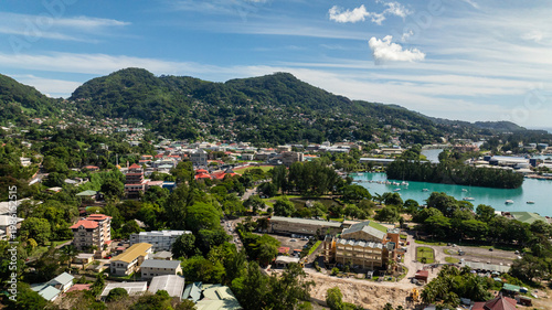 Harbor view with boats and cityscape nestled against green hills. Victoria. Seychelles, Mahe.