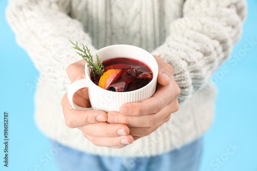 Man with mug of warm mulled...