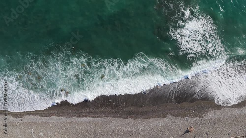 one-minute video of the surf from above. Static aerial view from a beach.