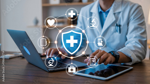 A doctor in a white lab coat using a laptop and tablet with medical icons floating above the keyboard.