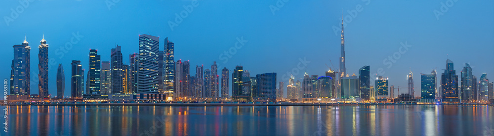 Obraz premium Dubai - The evening panorama over the new Canal with Downtown and Burj Khalifa tower.