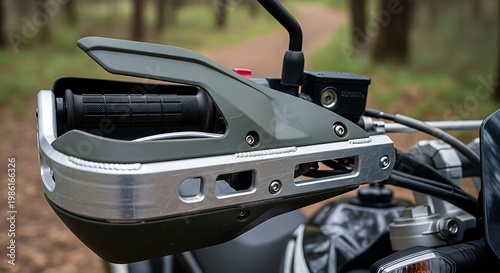 Motorcycle handlebar hand guard with metal protection shield close up.