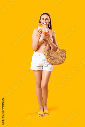Young woman with sunscreen ...