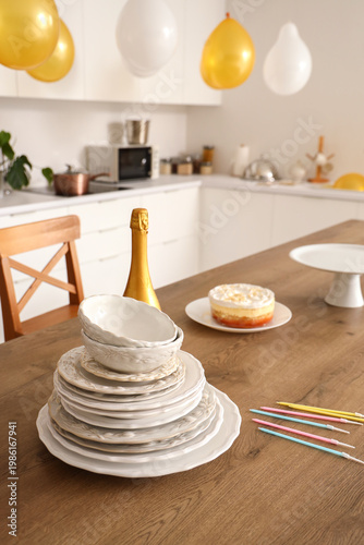 Plates with champagne bottl...