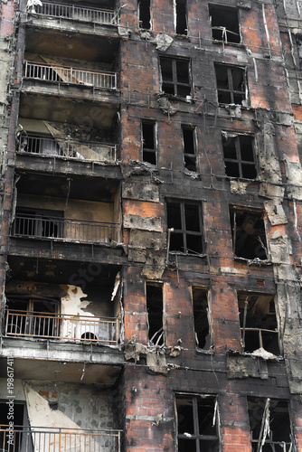 The building was badly damaged by the fire, the ruins and the black wall from the smoke of the fire