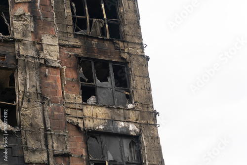 The building was badly damaged by the fire, the ruins and the black wall from the smoke of the fire