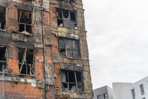 The building was badly damaged by the fire, the ruins and the black wall from the smoke of the fire