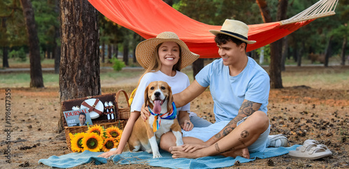 Young couple with Beagle do...