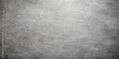 Aged dark grey brushed metal texture with a grunge vintage pattern on a rough textured surface backdrop