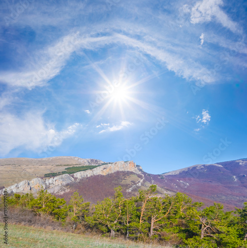 mountain ridge under a sparkle sun