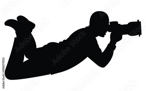 Photographer lying with camera silhouette icon representing photography and creative profession