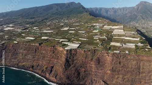 Banana Plantations and Caldera de Taburiente at Sunset in Tazacorte; La Palma Canary Islands Coastal Agriculture Aerial View; Tropical Farming and Volcanic Landscape