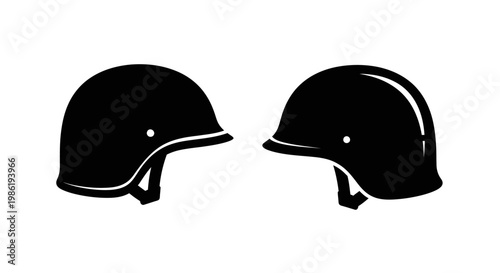 Two military helmets in black side views a striking silhouette