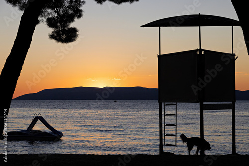 Sea with ship at Makarska on the Riviera at sunset, in Dalmatia in late summer