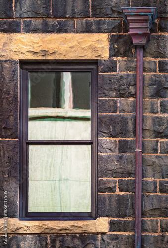 Antique Brownstone Building Coated with Soot and Urban Grime.