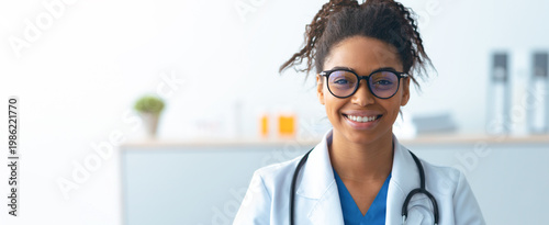 Slika na platnu A woman doctor stands in a modern office with a friendly smile