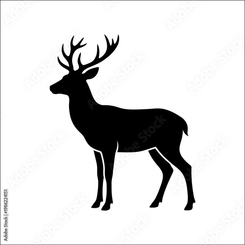 The silhouette of a deer with impressive antlers stands calmly in a serene landscape, evoking a sense of peacefulness and connection to nature.