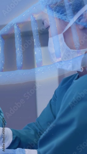 Vertical video: RN prepping tool for medical procedure gloved hands entering blue wave appearing