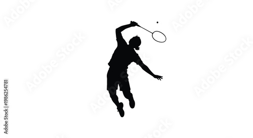 Silhouette of a badminton player mid air preparing to strike