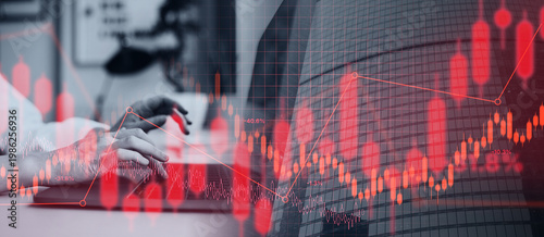 Schilderij op canvas Hands are typing on a computer keyboard while stock market graphs and data overlap in a finance office