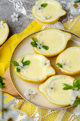 Εκτύπωση καμβά Lemon dessert in a lemon, decorated with flowers and leaves