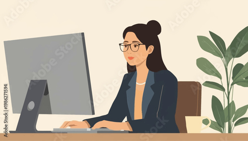woman working on computer at office desk.