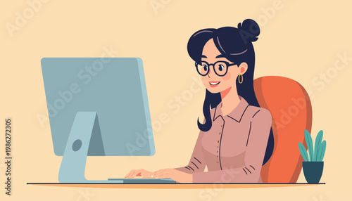 woman sitting at desk with computer and smiling.