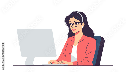 woman sitting at desk working on computer.