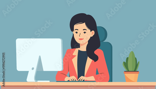 woman working on computer at desk.