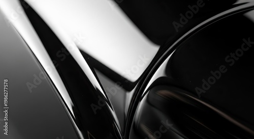 Abstract glossy black surfaces with dramatic lighting and reflections