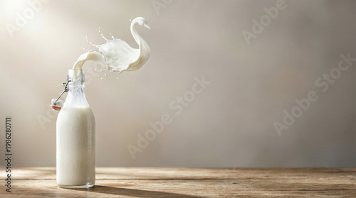 Creative Panoramic Banner of Milk Splash in the Shape of a Swan Emerging from a Glass Bottle on a Wooden Table with Copy Space