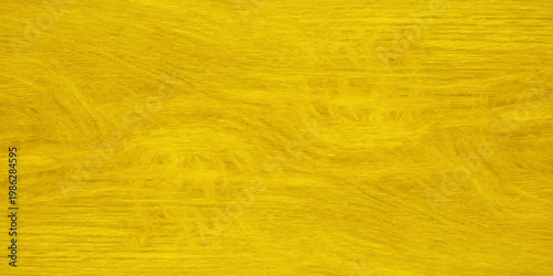 Bright yellow wood grain texture background with natural wavy patterns and golden hues