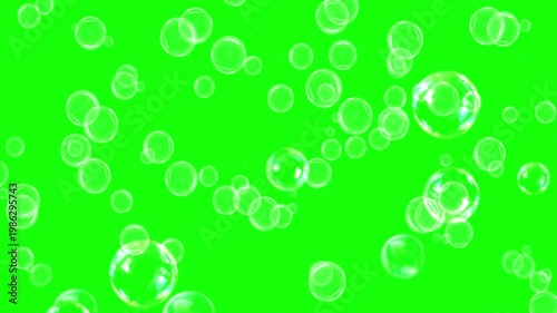 A video showcasing floating bubbles on a bright green background