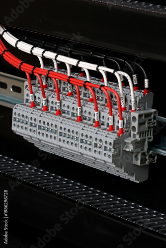 Electrical screw terminals for connecting copper electrical wires with metal lugs in electrical switchboard. 
