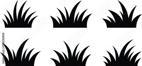 Six black grass clumps isolated on white background