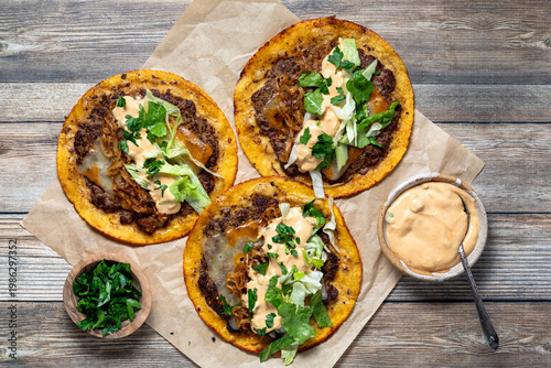 Above view of delicious smash burger tacos with fresh toppings.