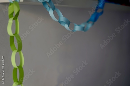 Handmade Wall Hanging Decoration. Crafted Paper Chain Creating Festive Ambiance In Minimal Setting