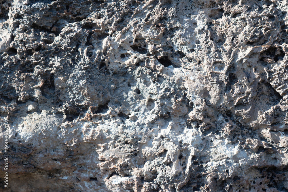 Fototapeta premium Close up of rough porous stone texture background.