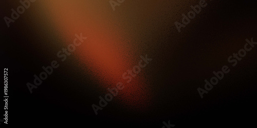 Warm light beam shining through darkness with vibrant orange and red hues slowly fading