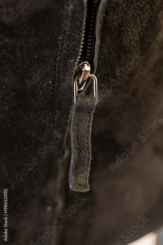 closure on shoes made of soft leather fabric, part of the shoe with zipper, soft shoes