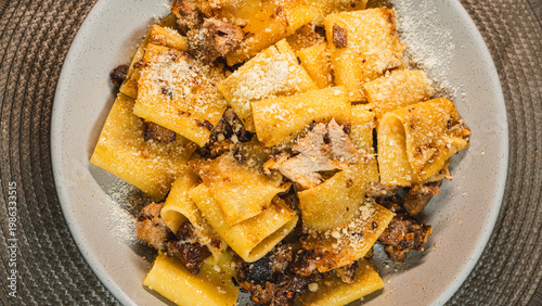 Εκτύπωση καμβά Paccheri pasta with minced pork, garlic and olive oil, topped with grated Parmesan cheese