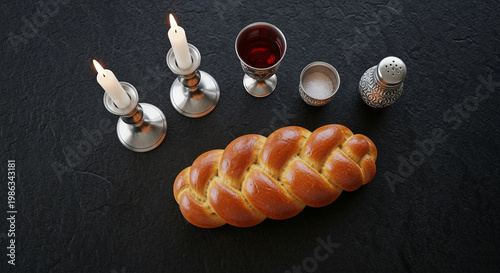 Challah bread loaf braided for traditional Jewish Shabbat dinner table setting