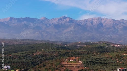 Aerial drone shot.View of famous beach in the summer, Crete, Greece. Famous beach with river and palm trees in Libyan sea. Tropical island, Panoramic view, Most beautiful beaches of Crete island