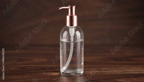 A transparent glass bottle filled with a clear liquid