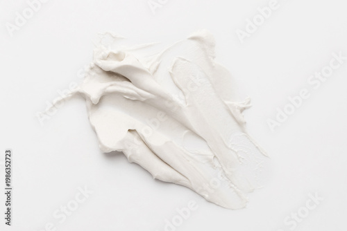 Canvastavla White cosmetic cream texture spread on white background, top view