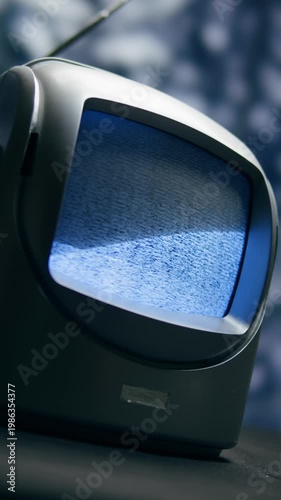 Retro TV, vintage television In a nostalgic setup, a retro TV displays grain on screen, scary halloween night device good for chroma key and green screen.