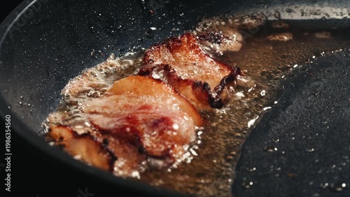 Fat tailed sheep lamb Lard with a golden crust is melted in a stainless steel pan. Cooking traditional uzbek dish, middle eastern food. 
