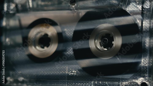 Retro radio tape recorder, audio cassette close-up. Listening to music, old radio boom box player, macro of vintage music listening. 