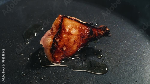 Fat tailed sheep lamb Lard with a golden crust is melted in a stainless steel pan. Cooking traditional uzbek dish, middle eastern food. 