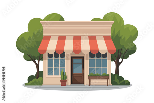 Small shop building with striped awning and trees.